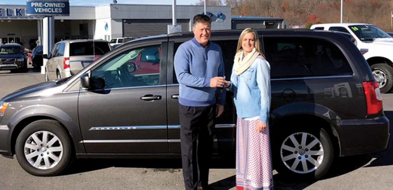 Submitted photo Elkins Automotive owner Jim Jackson and Shannon Putnam, marketing director for Highland-Clarksburg Hospital, pose outside Elkins Auto